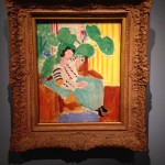 Matisse painting with philodendrum and striped wallpaper