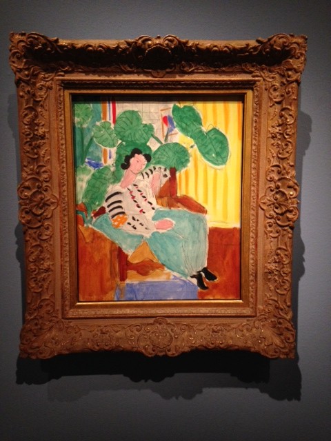 Matisse painting with philodendrum and striped wallpaper