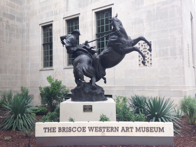 Photo of a scupture outside of the Briscoe Western Art Museum.