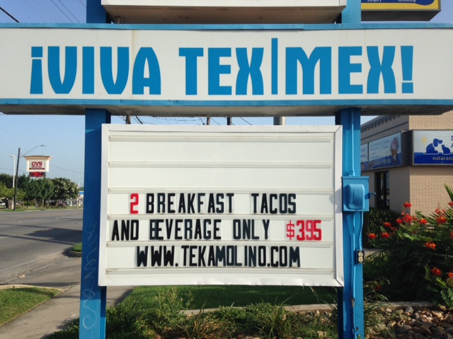 Photo of the sign outside of Teka Molino that reads 2 Breakfast Tacos and Beverage only $3.95. Viva Tex-Mex!