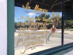 Photo of a memorial on the window of the Blanco Cafe.