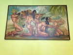 Photo of a painting with native people bringing gifts of food to the gods.