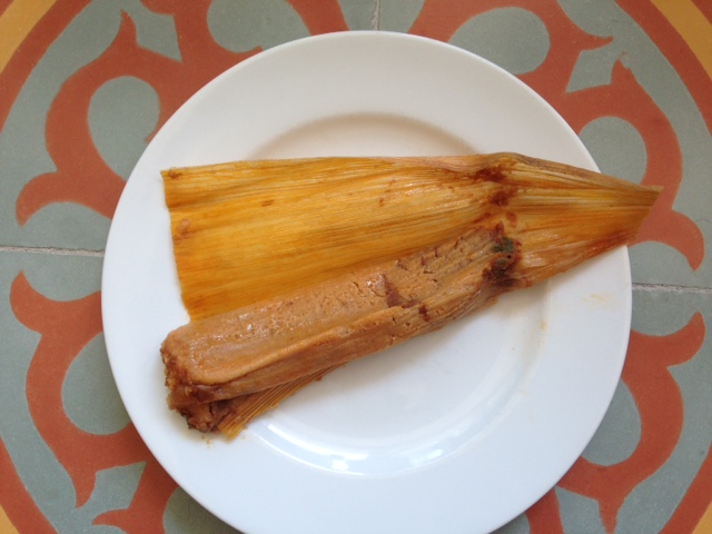 Photo of unwrapped bean tamale at Adelita Tamales & Tortilla Factory.