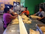 Photo of tamale assembly line at Adelita Tamales & Tortilla Factory.