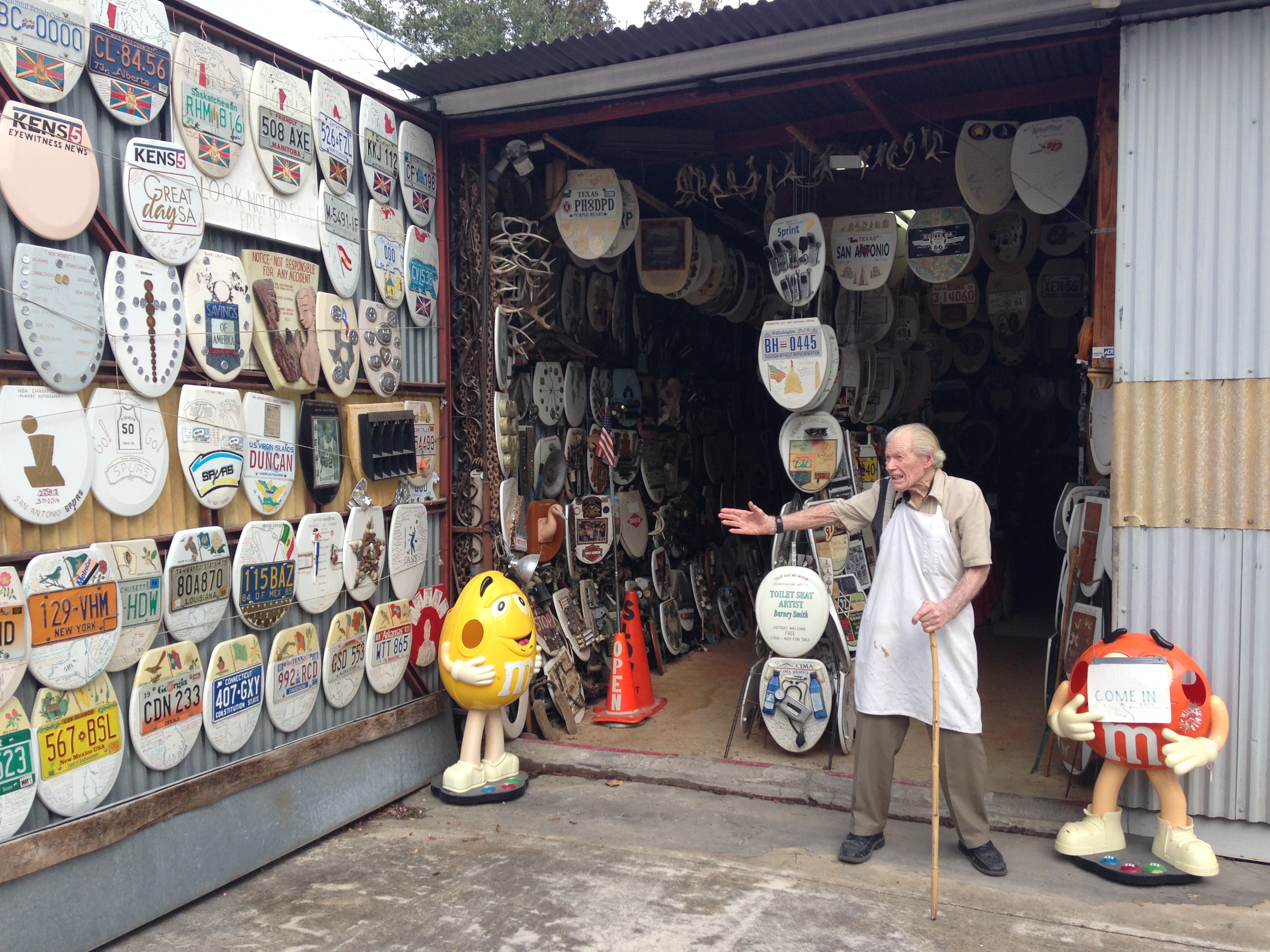 Photo of Folk Artist Barney Smith outside of his Toilet Seat Art Museum.