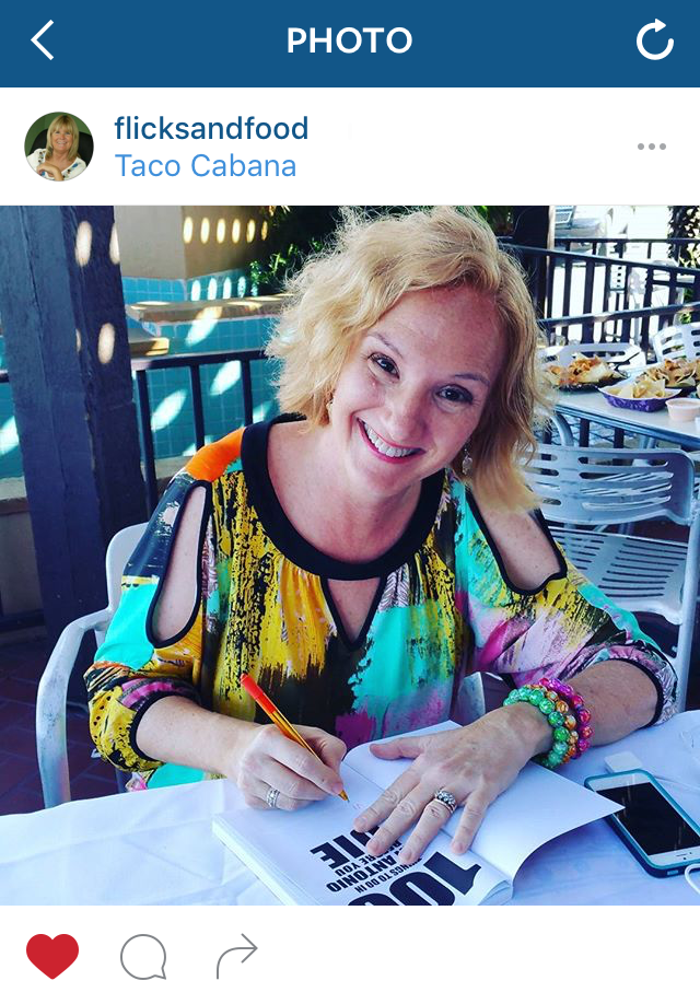 Photo of Denise Richter, author of "100 Things To Do in San Antonio Before You Die" signing her book at Taco Cabana.