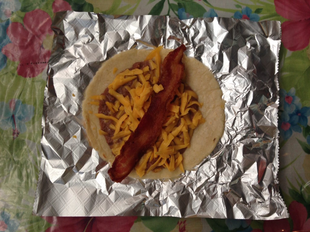 Photo of a bean, cheese and bacon taco at Maria's at 1105 Nogalitos in San Antonio, Texas.