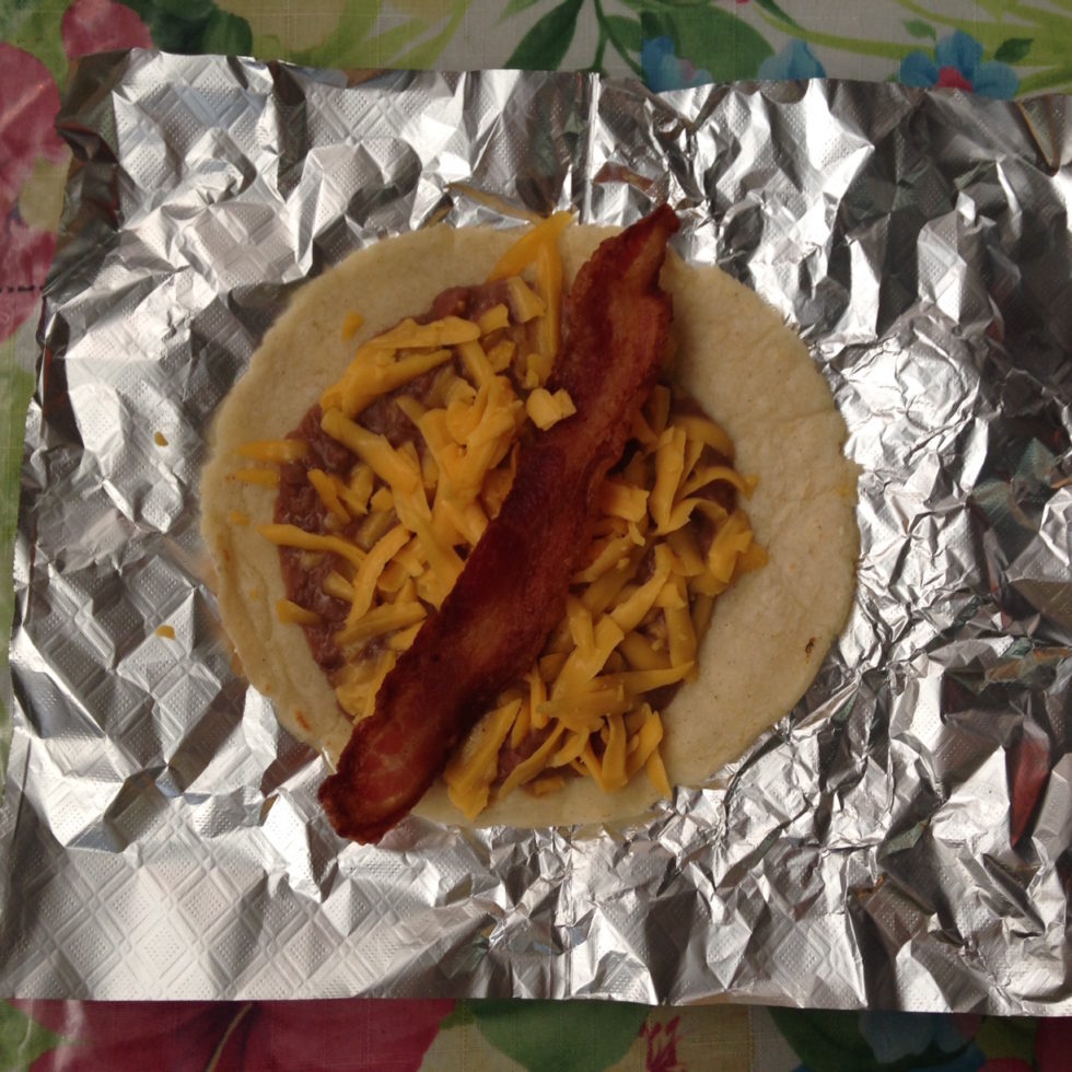 Photo of a bean, cheese and bacon taco at Maria's at 1105 Nogalitos in San Antonio, Texas.