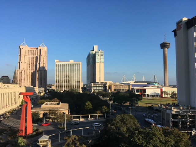 Photo of the San Antonio skyline looking east with the Torch of Friendship and the Tower of the Americas